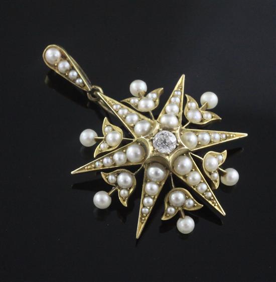An Edwardian gold, split pearl and diamond set starburst pendant, 42mm.